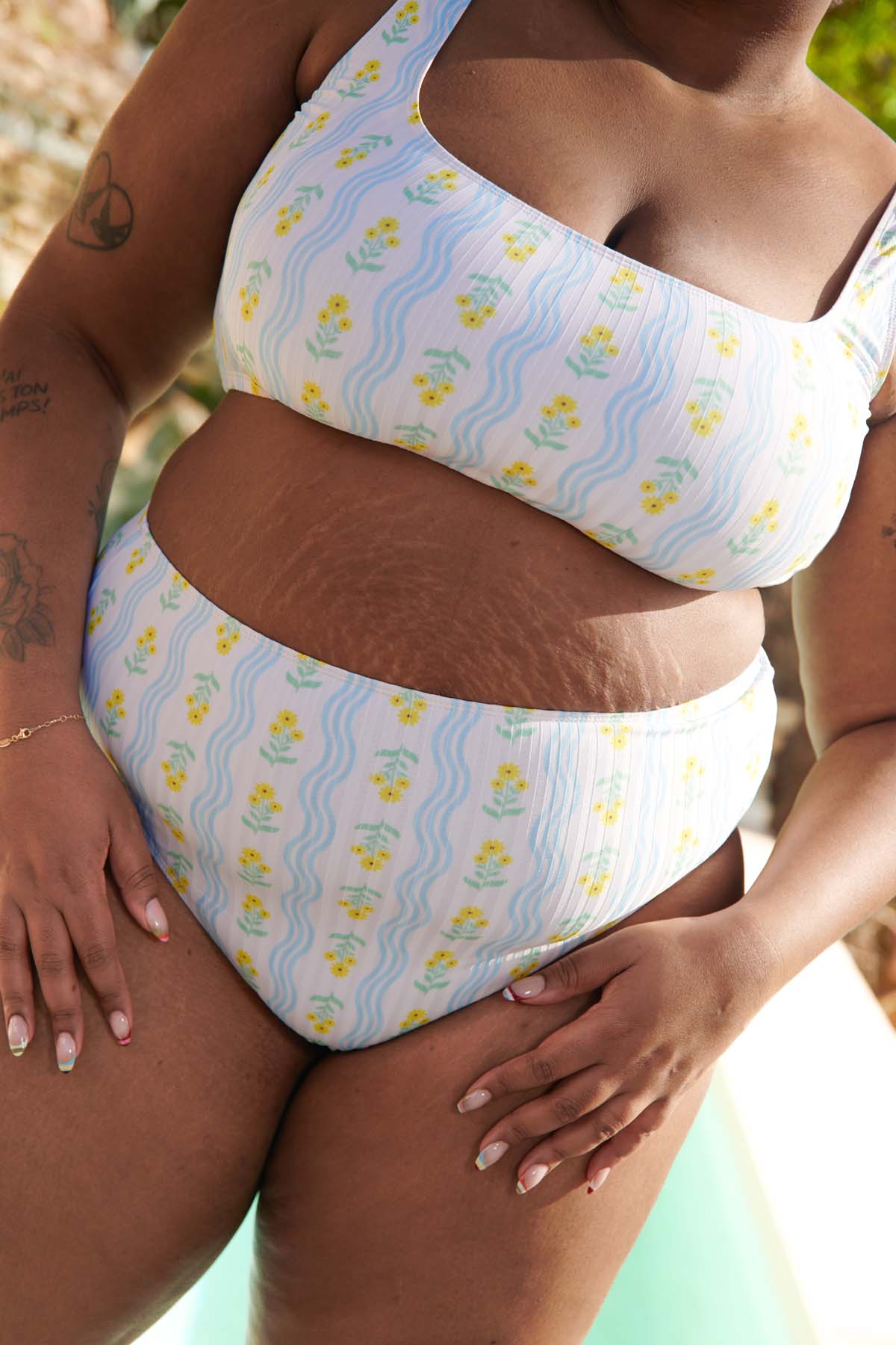 Tiffany is a size 105E and 48 and wears a size 3XL on the top and bottom